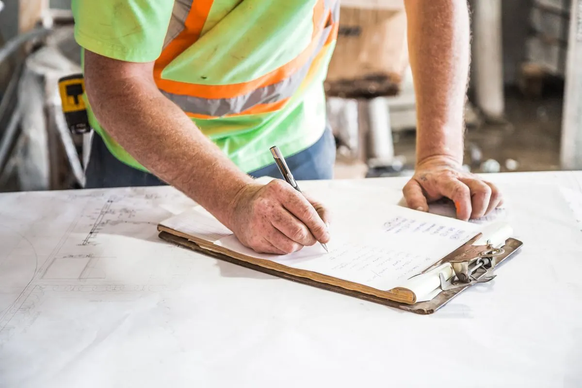 Close-up of a punch list form with items, owners, and due dates